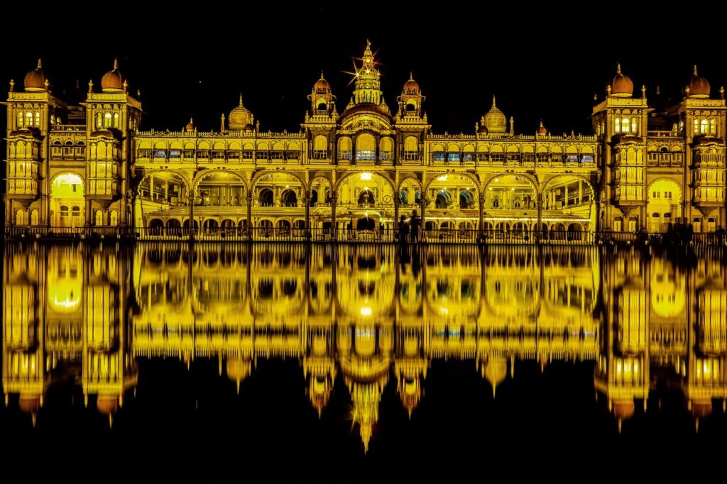 Mysore Dussehra" Mysore Palace illuminated with festive lights during Dussehra celebrations, attracting thousands of visitors.
