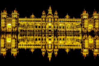 Mysore Dussehra: Mysore Palace illuminated with festive lights during Dussehra celebrations, attracting thousands of visitors.