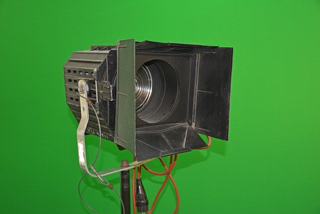 how to use chroma key in premiere: bright green screen background with visible cables