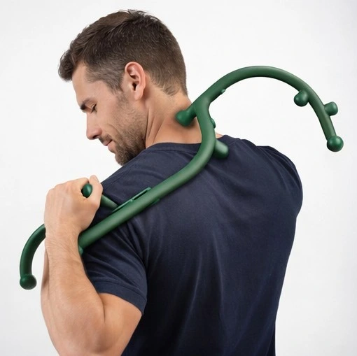 how to use a theracane: Person using an ergonomic massage cane to relieve shoulder muscle tension