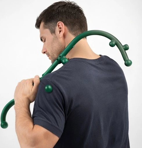 Lifestyle image showing massage cane used for upper back muscle recovery